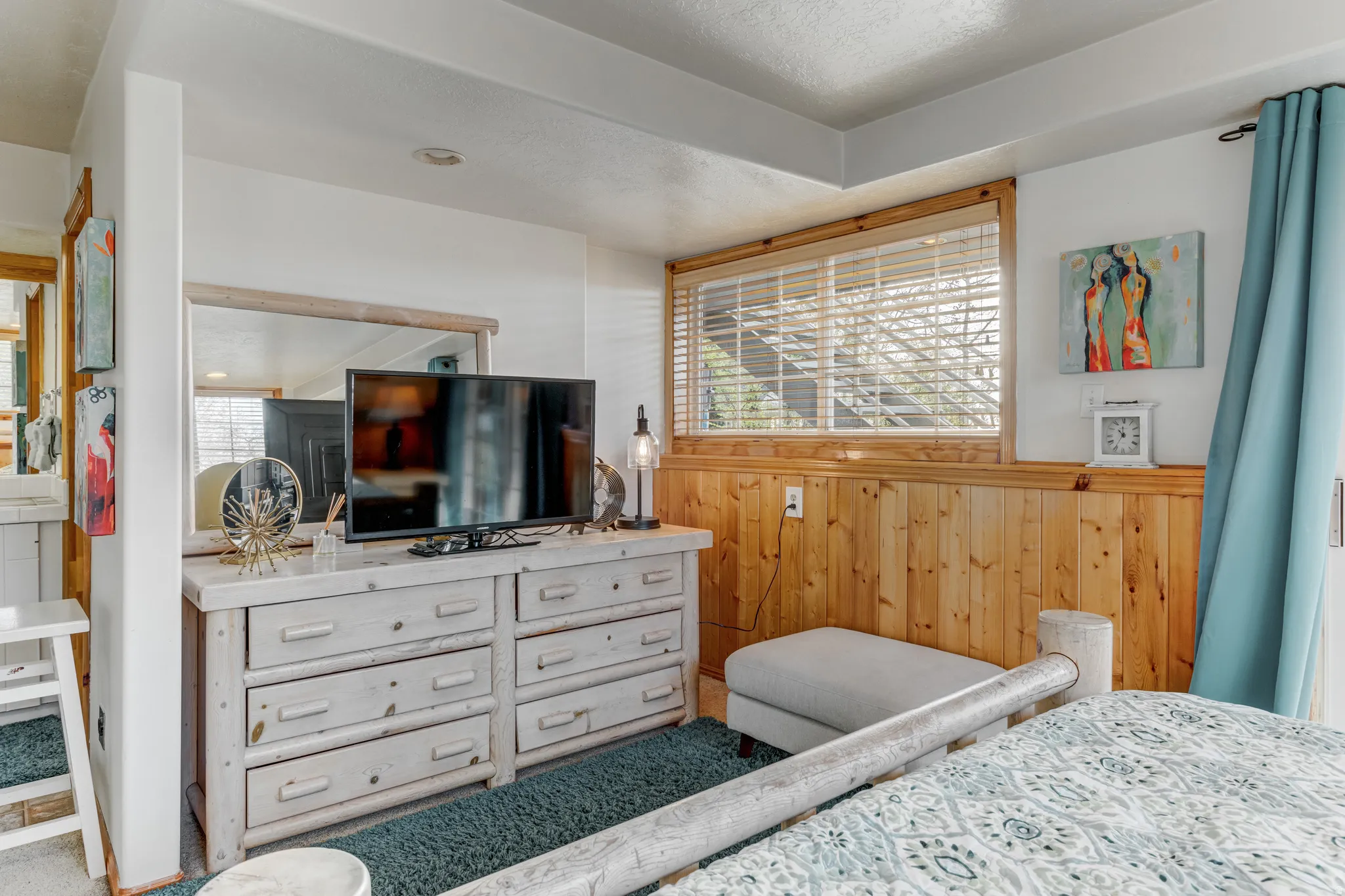 Bedroom with wood walls