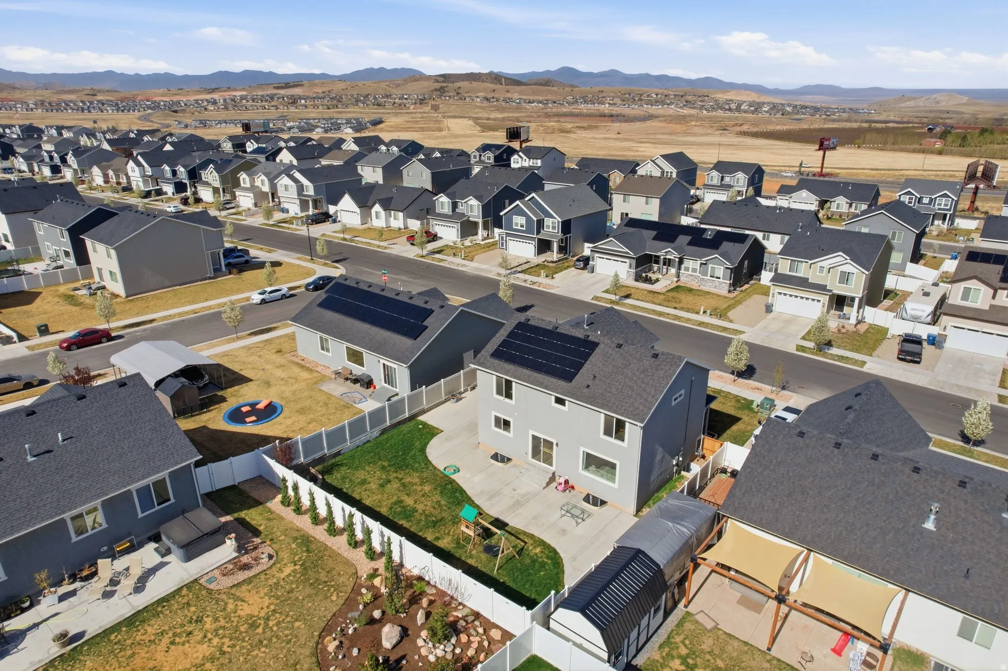 Aerial view of residential area featuring a mountainous background