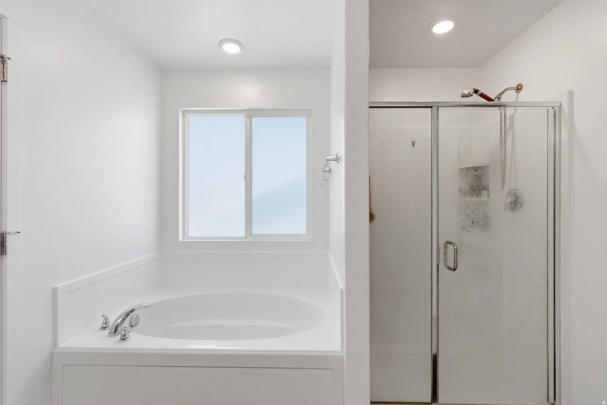 Master Bath  stall shower and a bath