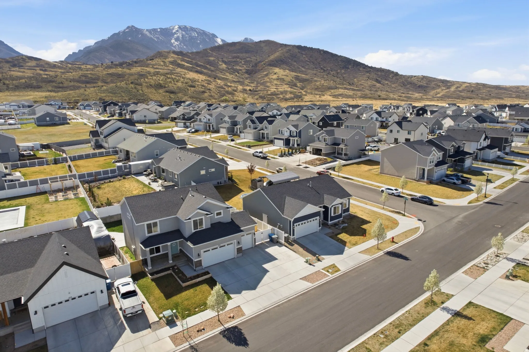 Aerial perspective of suburban area featuring a mountain backdrop