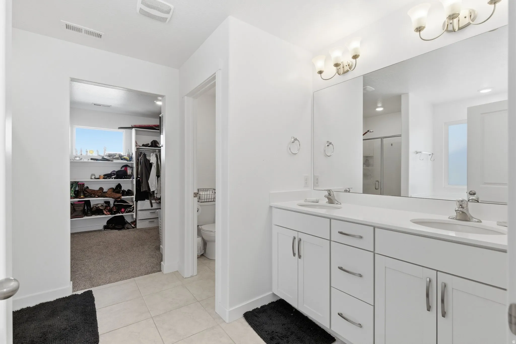 Bathroom featuring double vanity