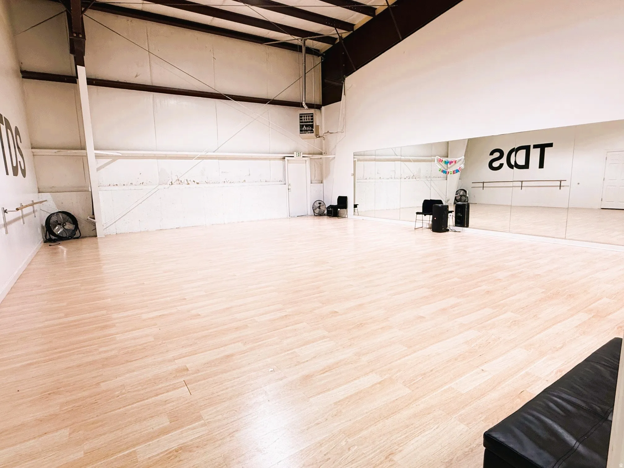 Misc room with a high ceiling and a heating unit