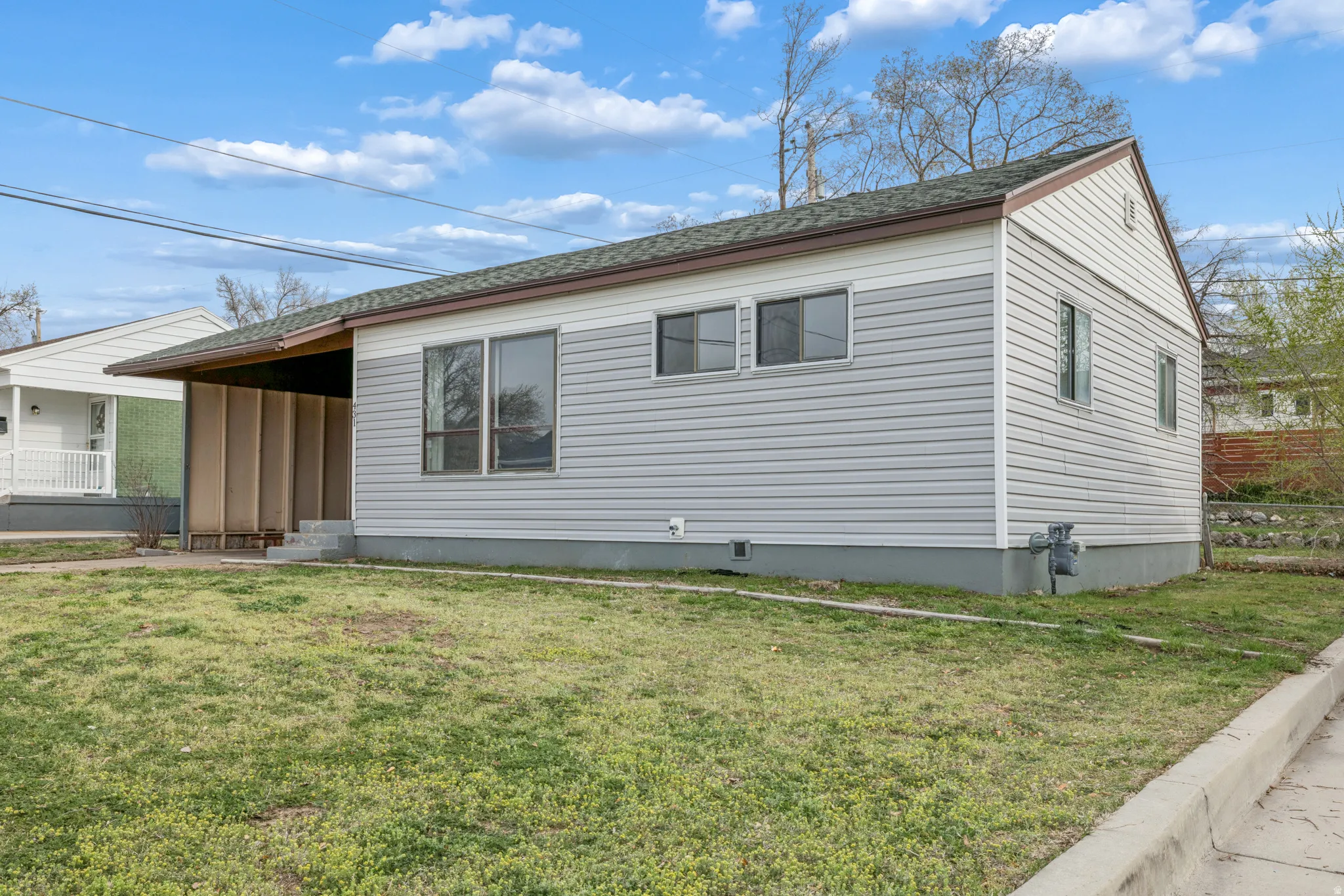 View of property exterior featuring roof with shingles