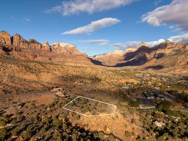 View of mountain backdrop featuring a desert landscape
