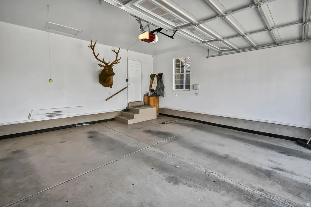 Garage featuring a garage door opener