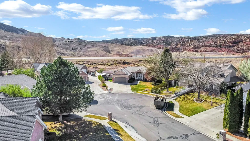 Aerial view of residential area featuring a mountain backdrop