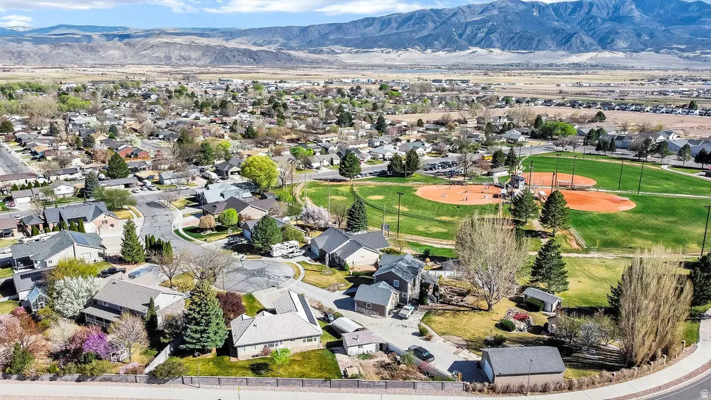 Aerial perspective of suburban area with a mountainous background