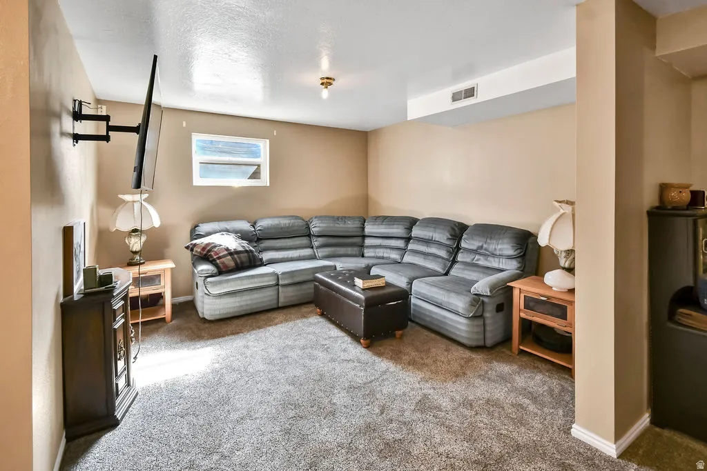 Living room with carpet flooring and baseboards