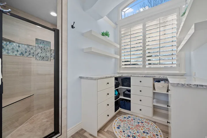 Walk in closet featuring light wood-type flooring
