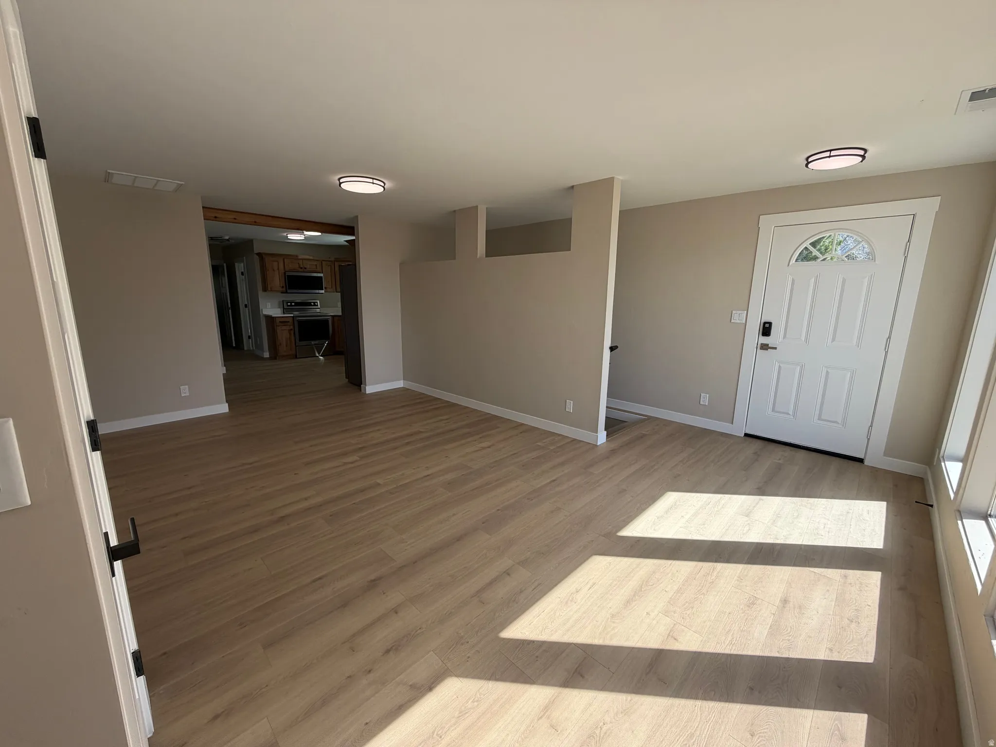 Foyer featuring light wood-style floors