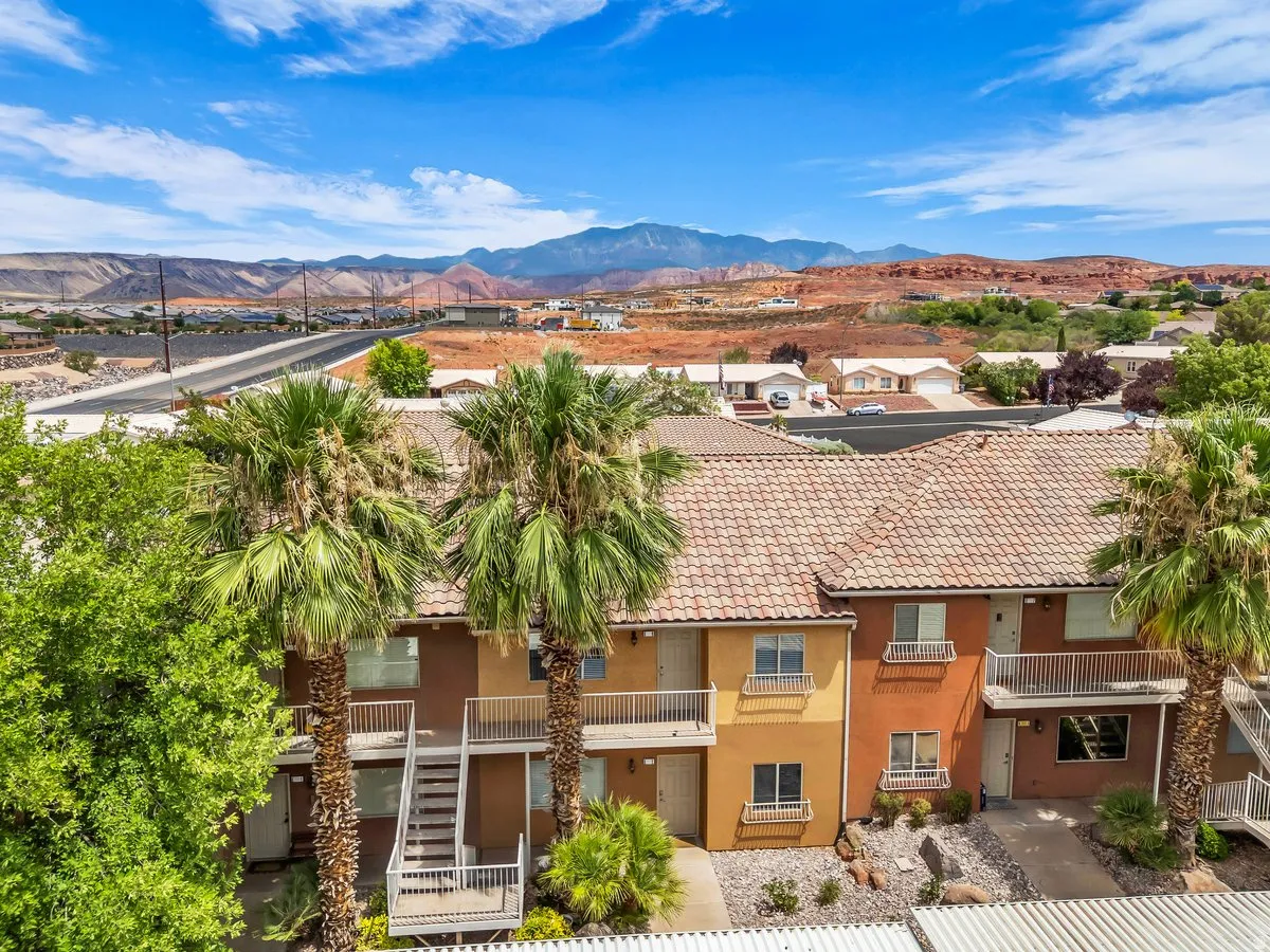 Multi-story residential buildings featuring tiled roofs and stucco exteriors
