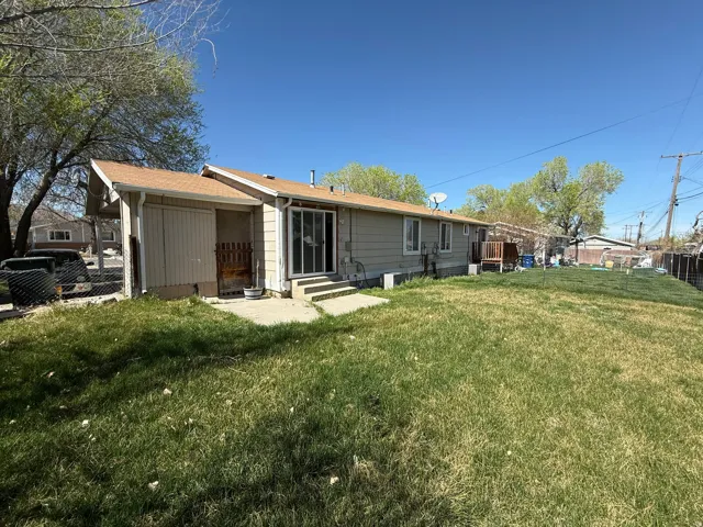 Back of house featuring entry steps