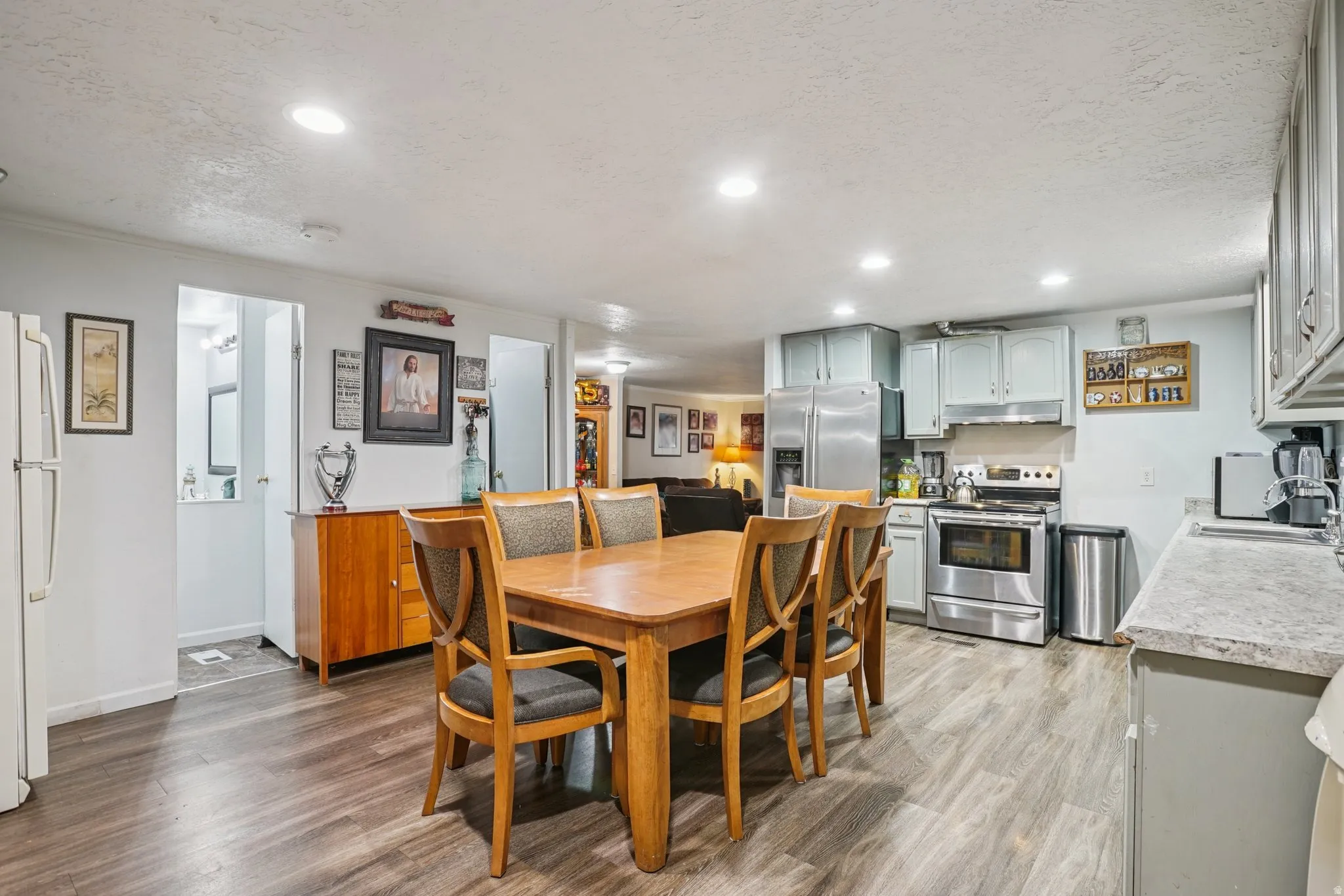 Dining space featuring light wood-type flooring and recessed lighting