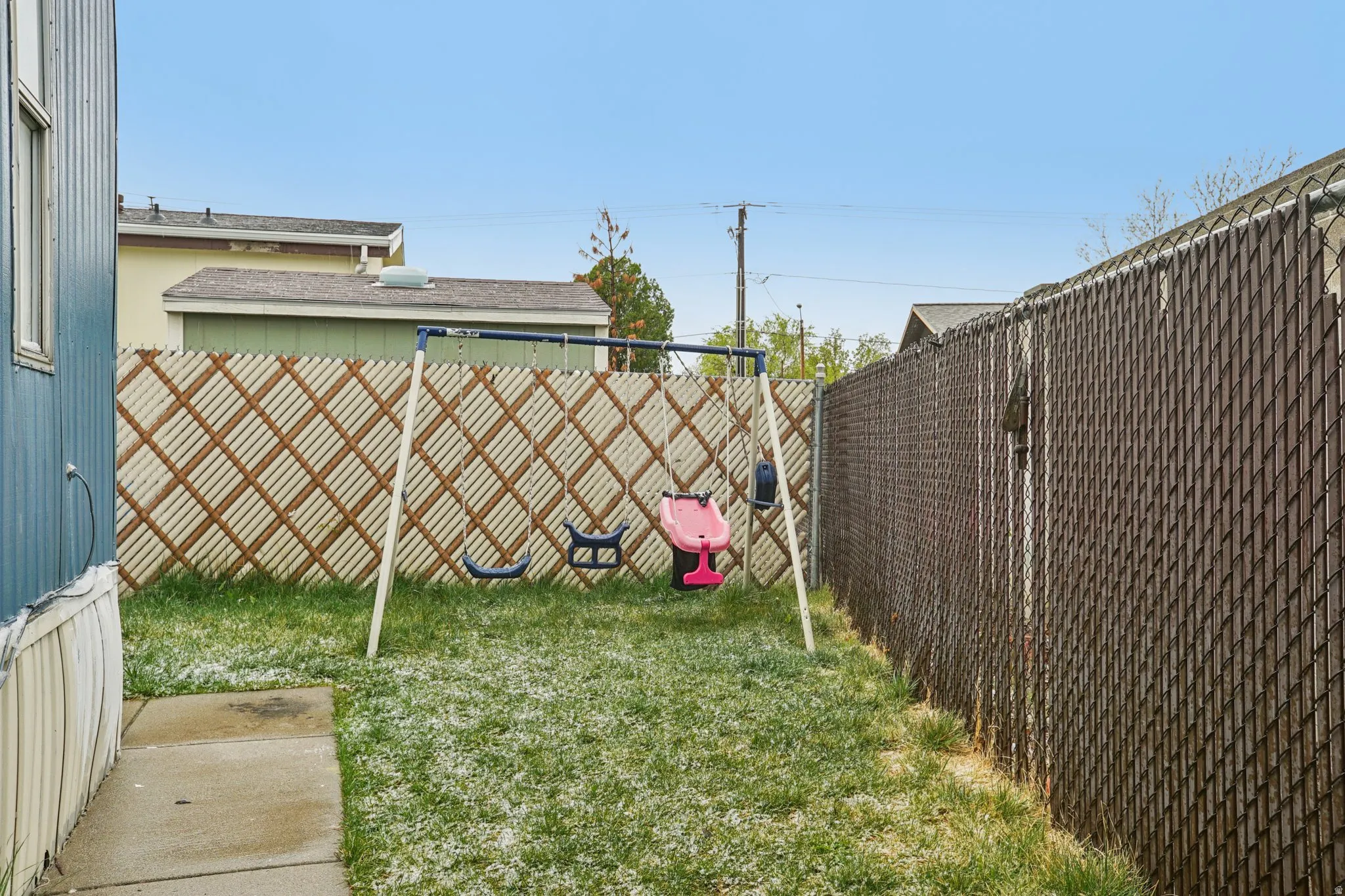 View of fenced backyard