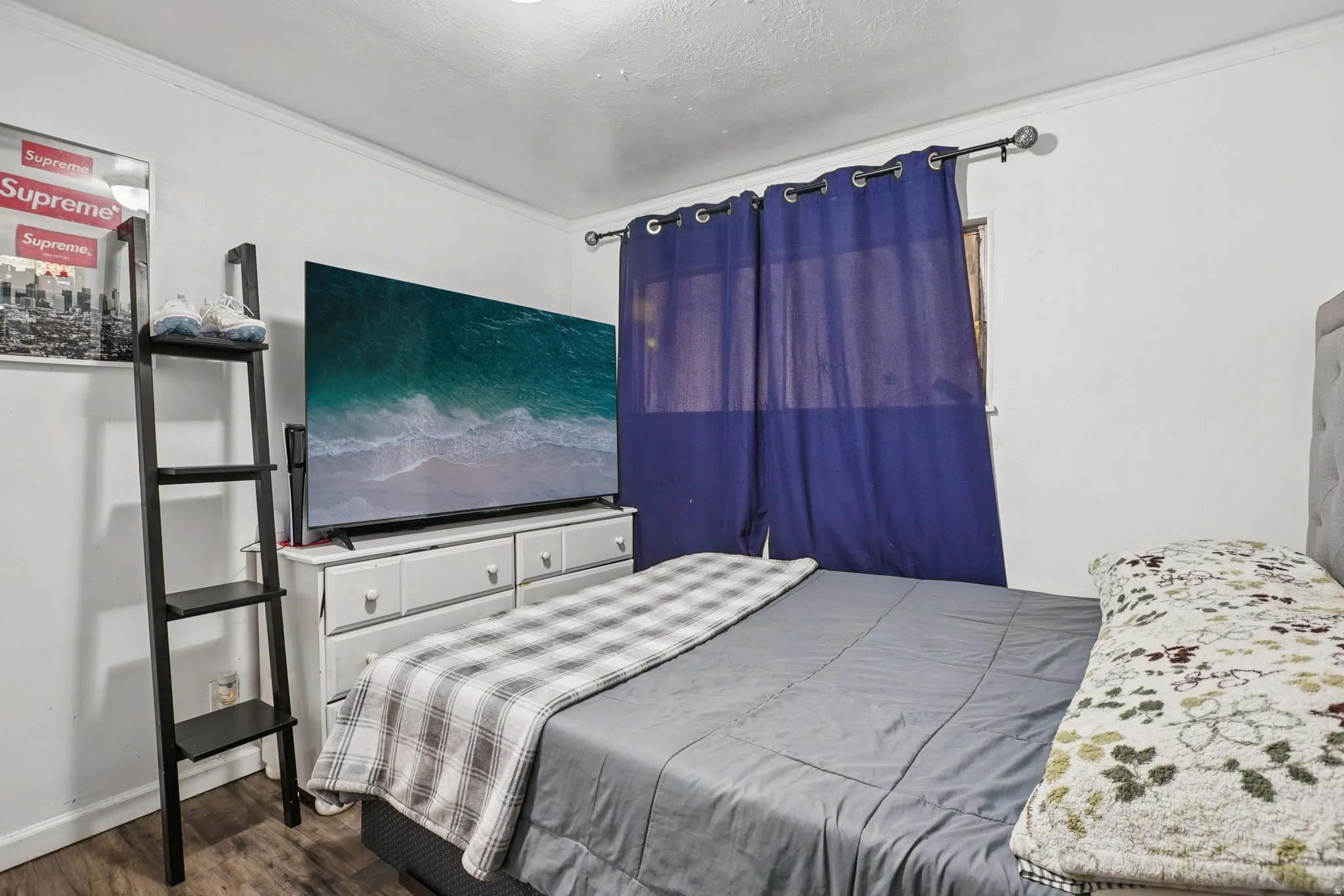 Bedroom with dark wood-type flooring