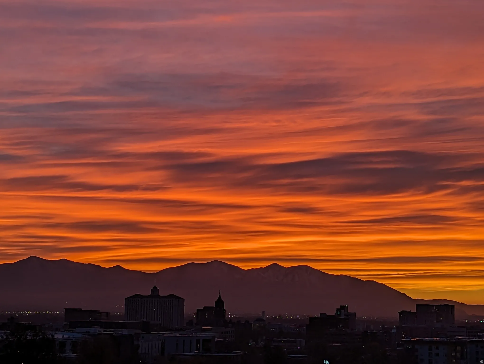 View of mountain backdrop with nearby urban area