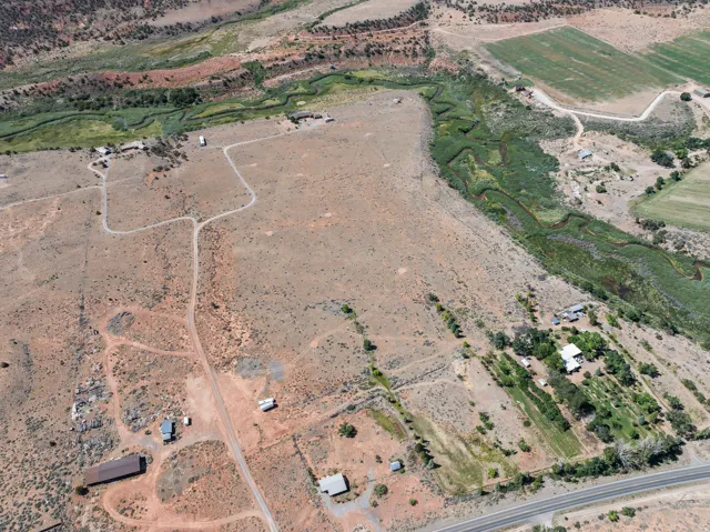 Aerial view of property and surrounding area featuring rural landscape