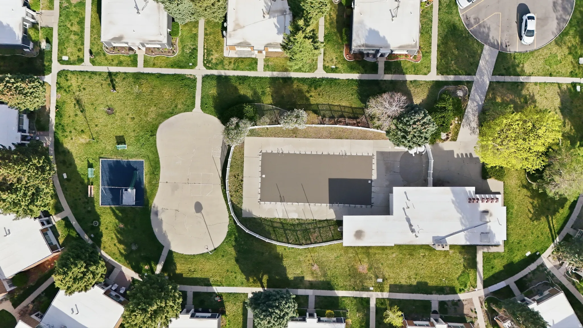 Pool, basketball court, and playground