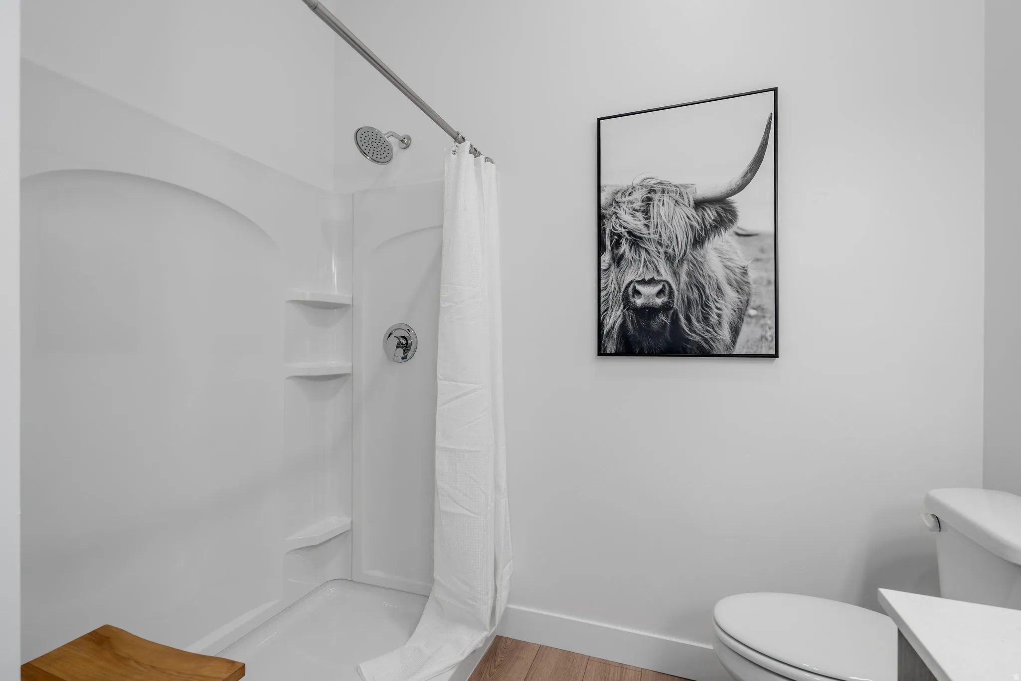 Primary bedroom en suite with double vanity and walk in shower.