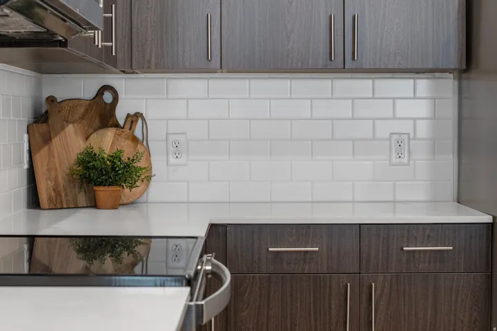 Kitchen with dark wood tone finishes and stainless steel appliances. *fridge not included*