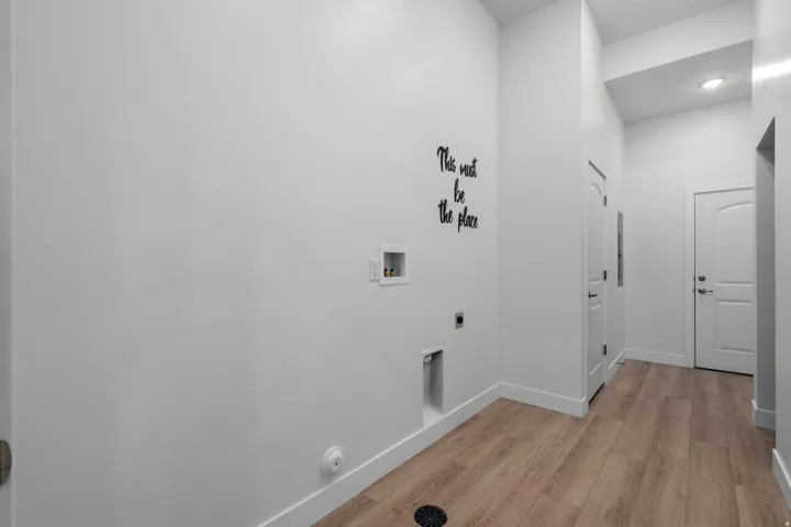 Laundry room with additional storage and access to the garage and community breezeway.