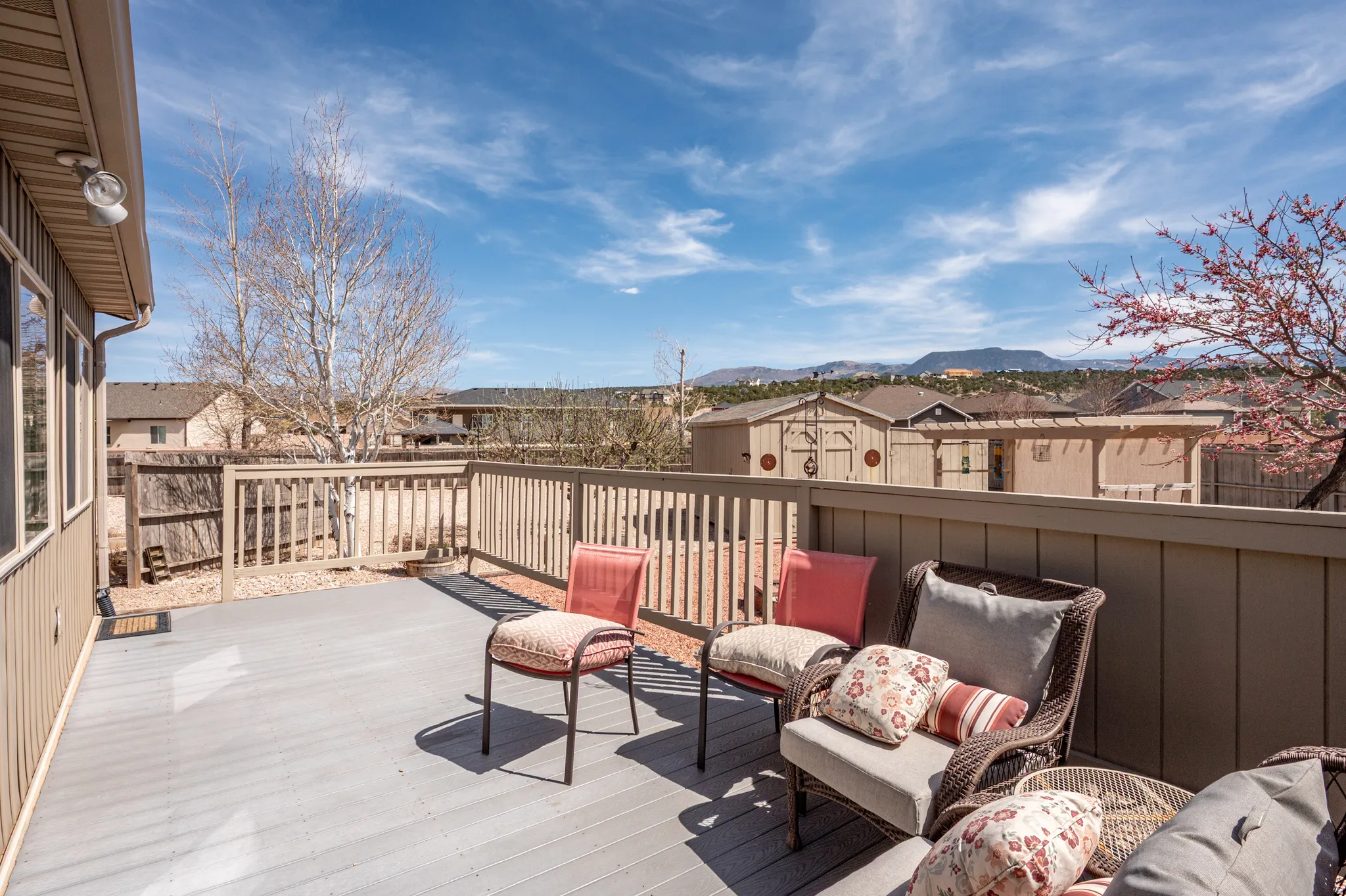 Wooden deck with a residential view and an outdoor lounge area