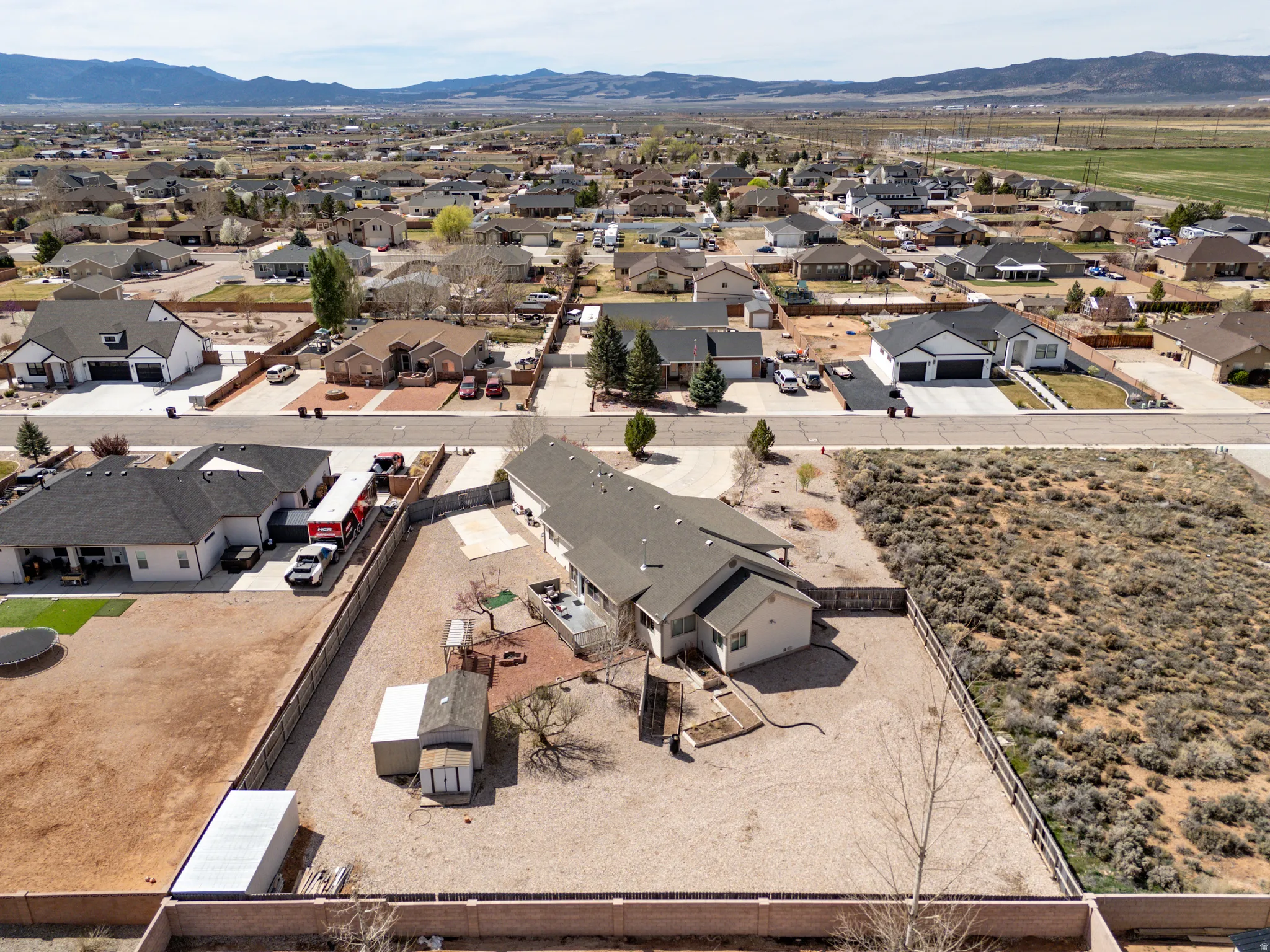 View of property location featuring a mountain backdrop and nearby suburban area