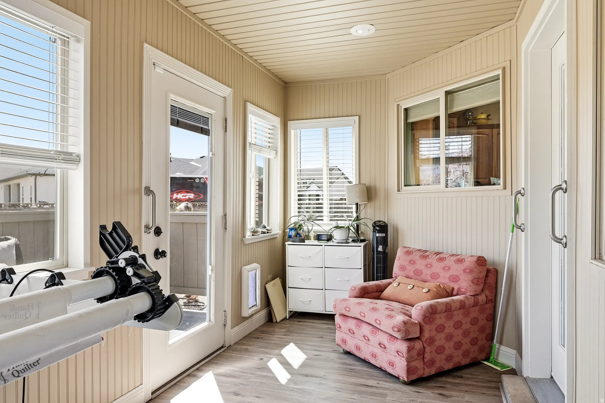 Sunroom / solarium with wood finished floors