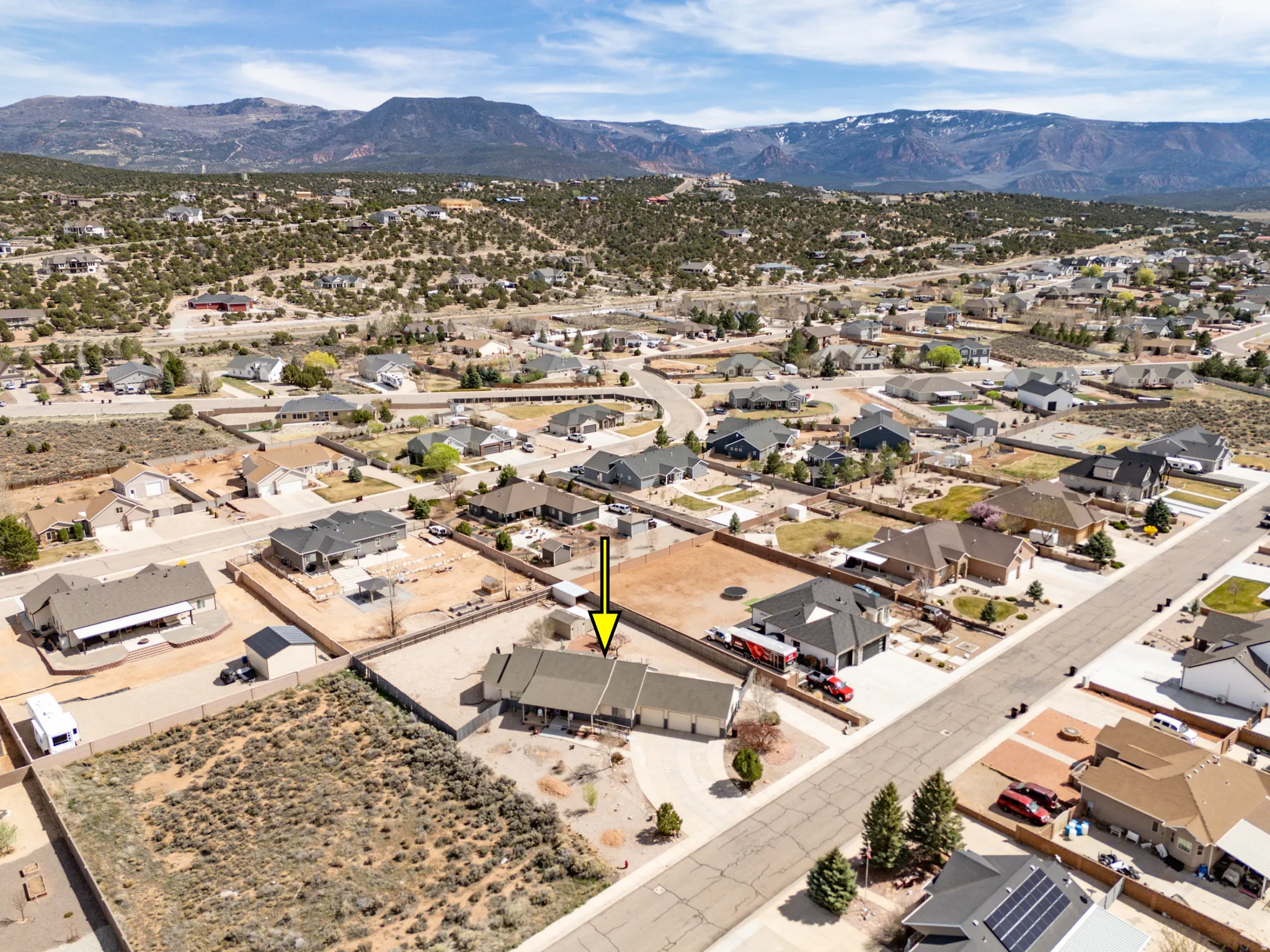Aerial perspective of suburban area featuring mountains