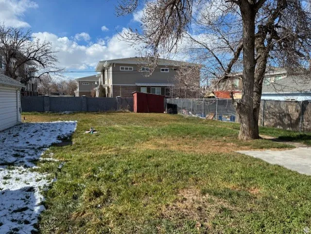 View of fenced backyard