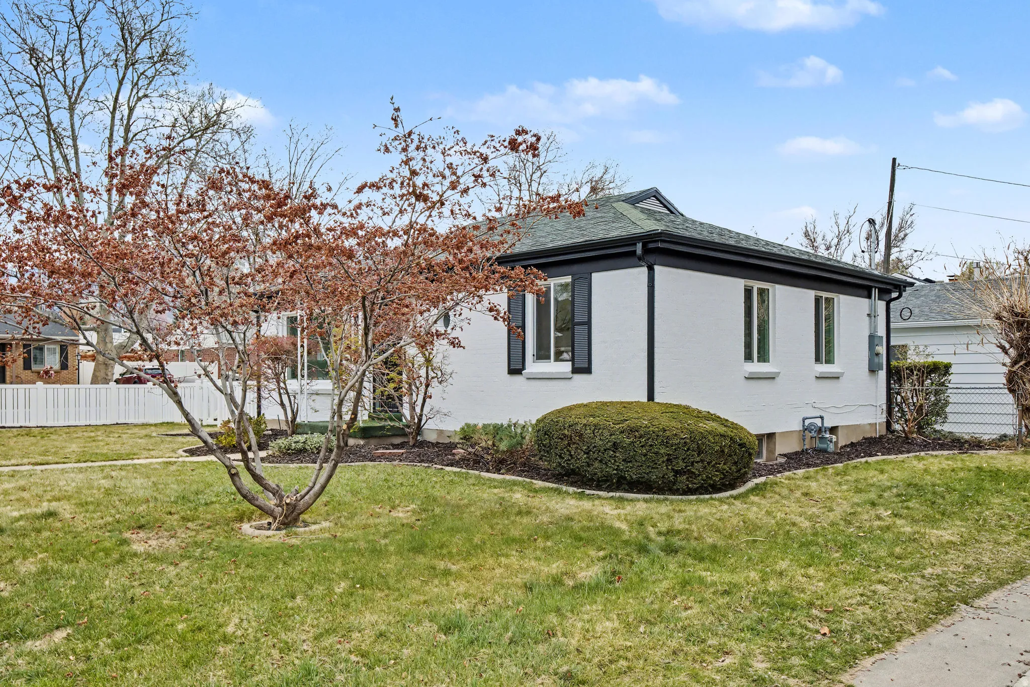 View of side of property featuring brick siding