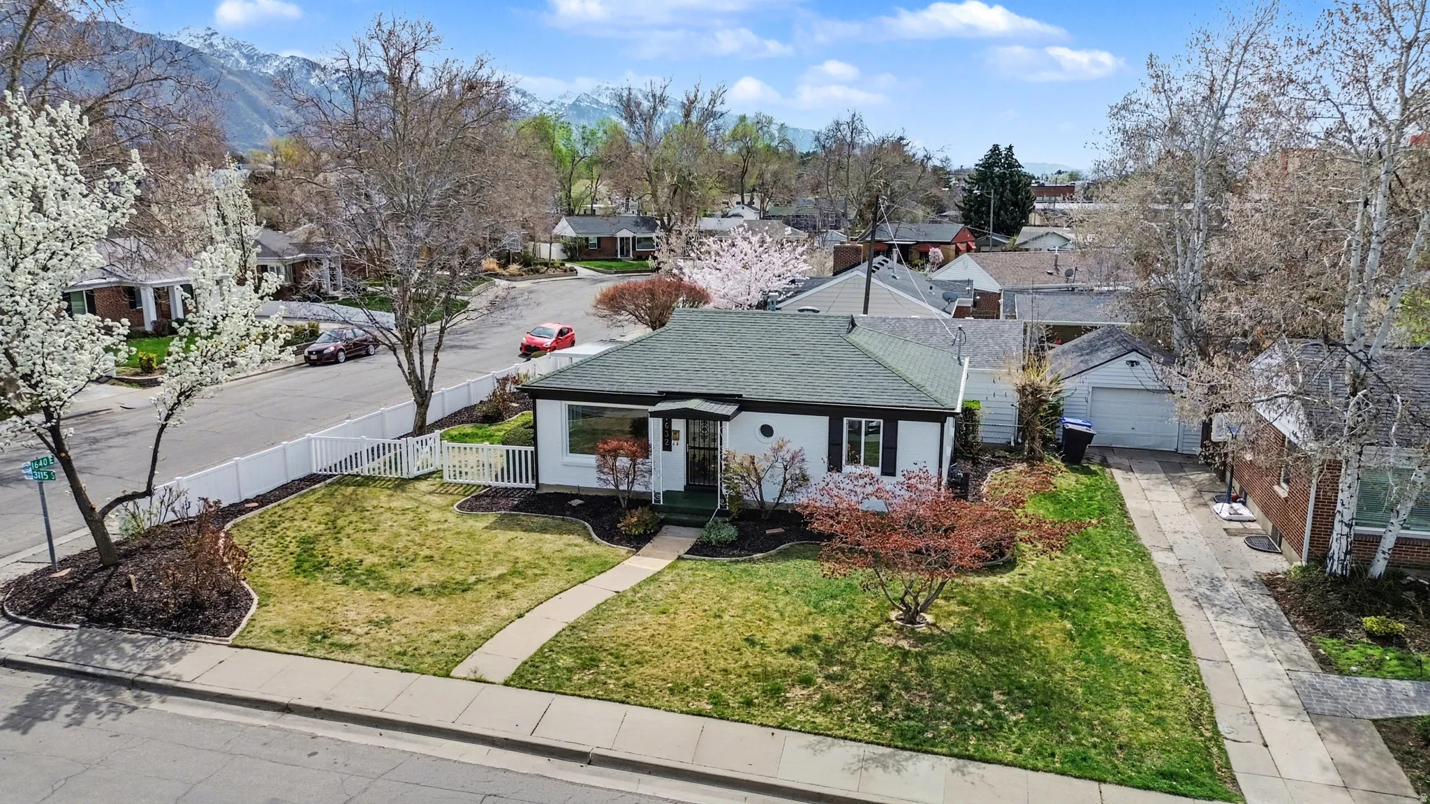 View of front of property featuring roof with shingles and a residential view