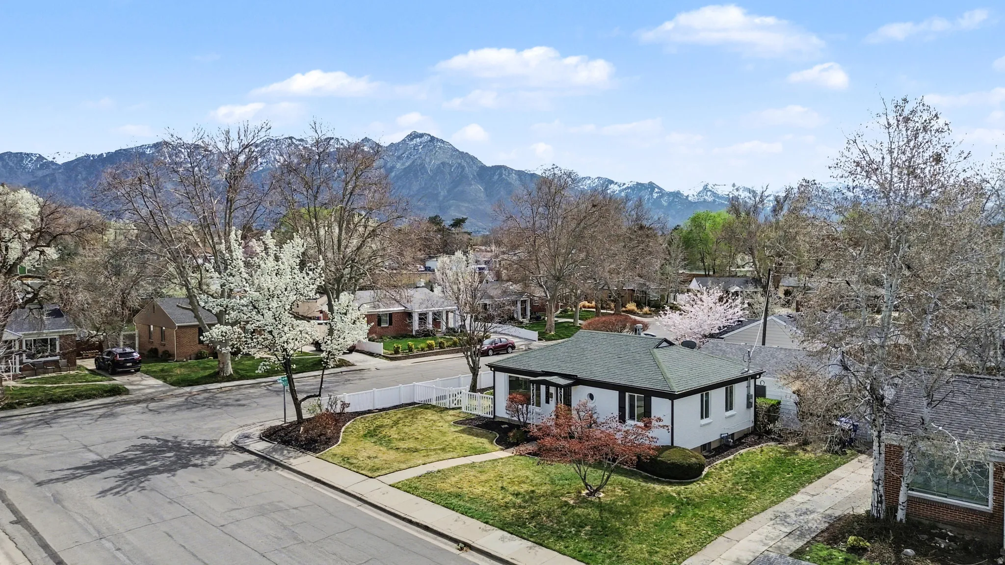 Aerial perspective of suburban area with a mountainous background