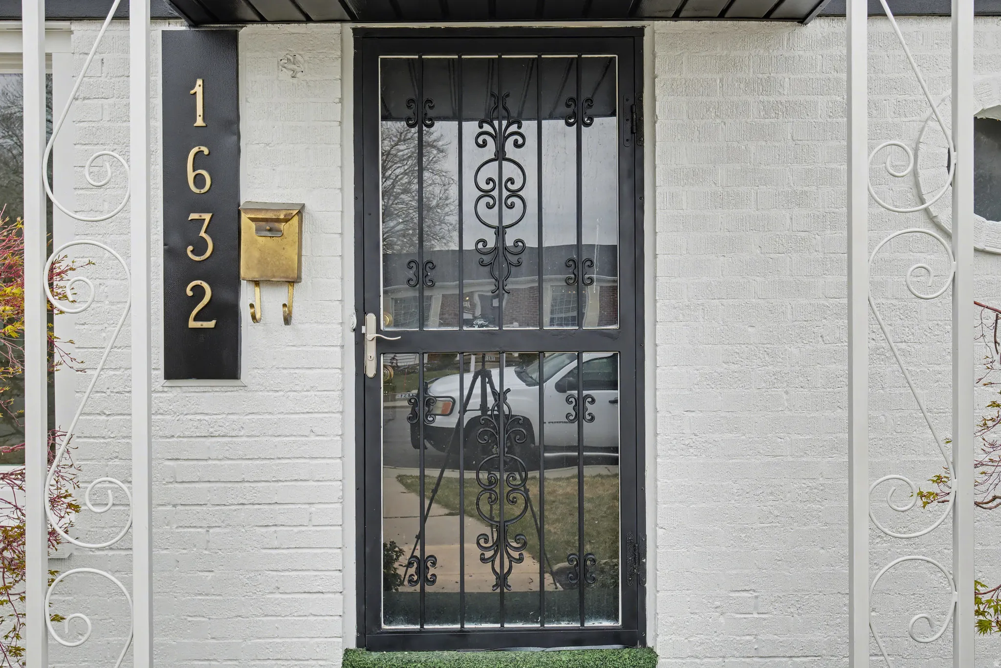 Doorway to property with brick siding