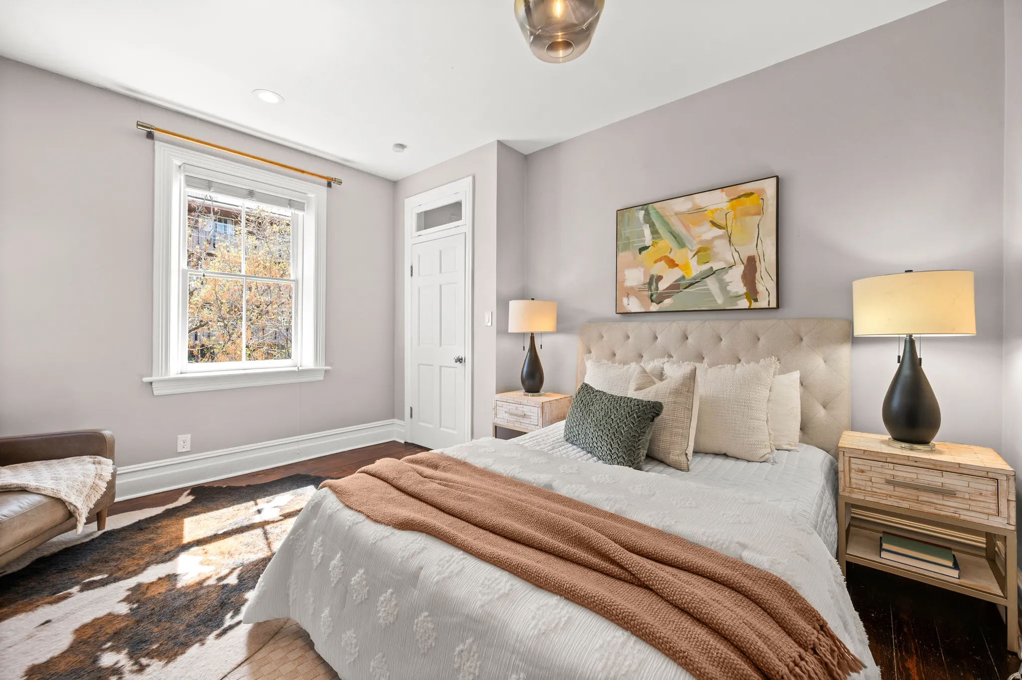 Bedroom featuring baseboards and wood finished floors