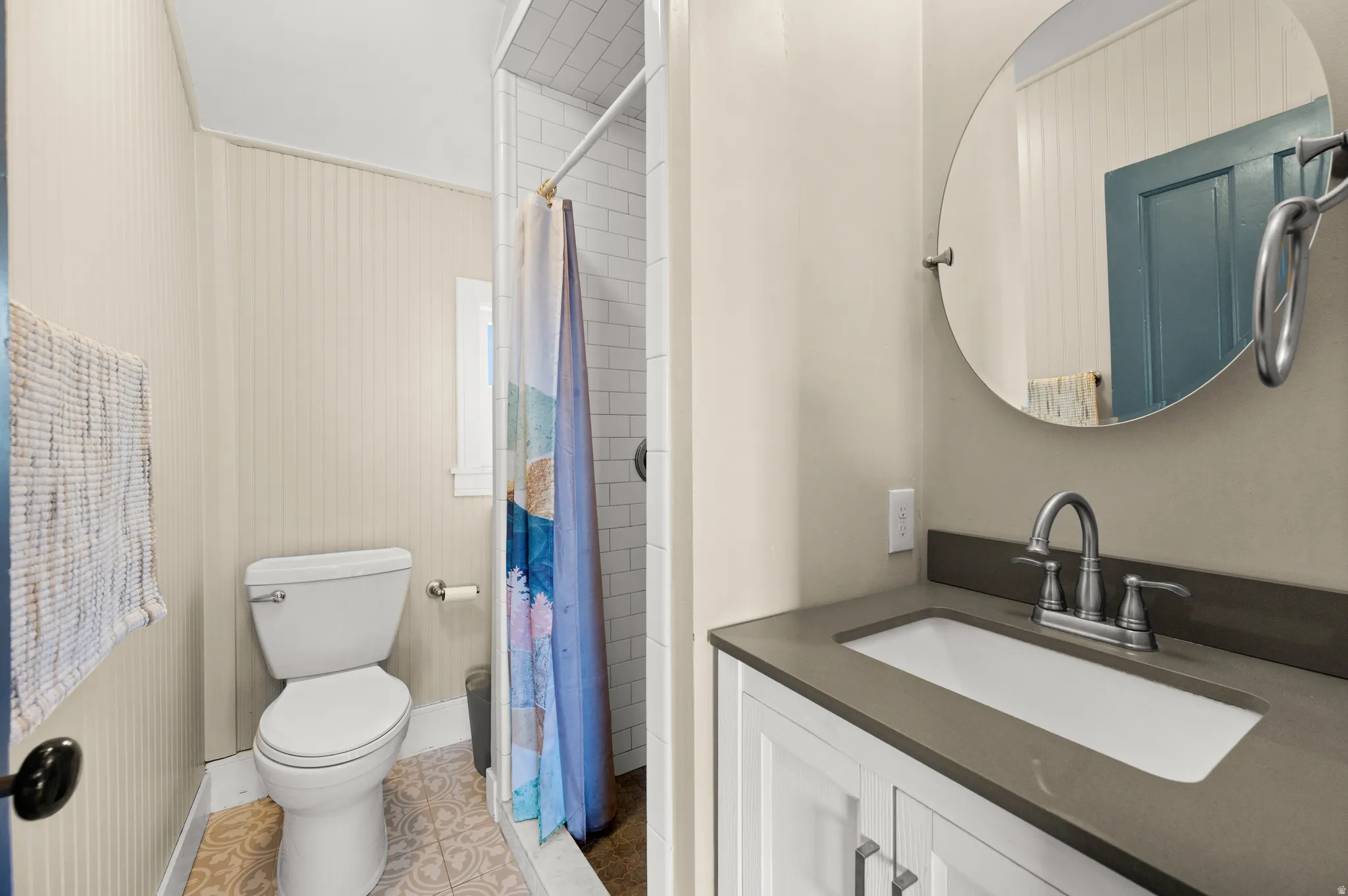 Bathroom featuring vanity and a shower stall
