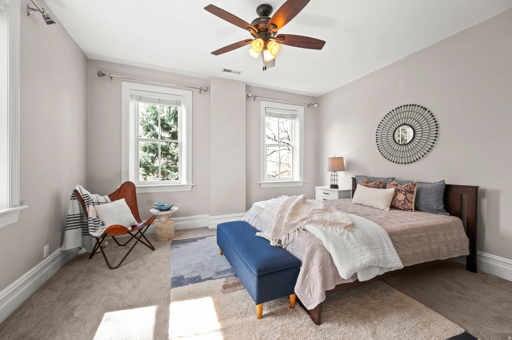 Bedroom with carpet flooring and a ceiling fan