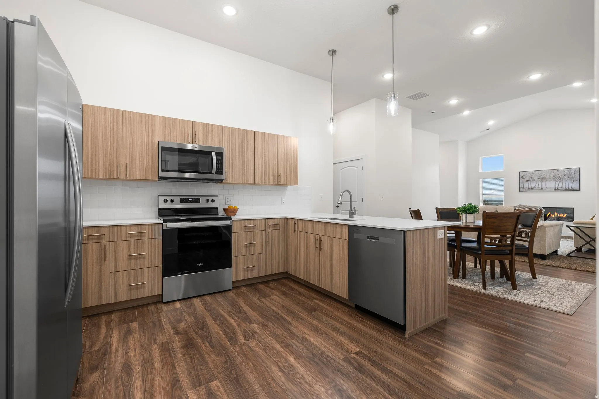 Modern Kitchen with quartz counters and stainless steel appliances. *Fridge not included*