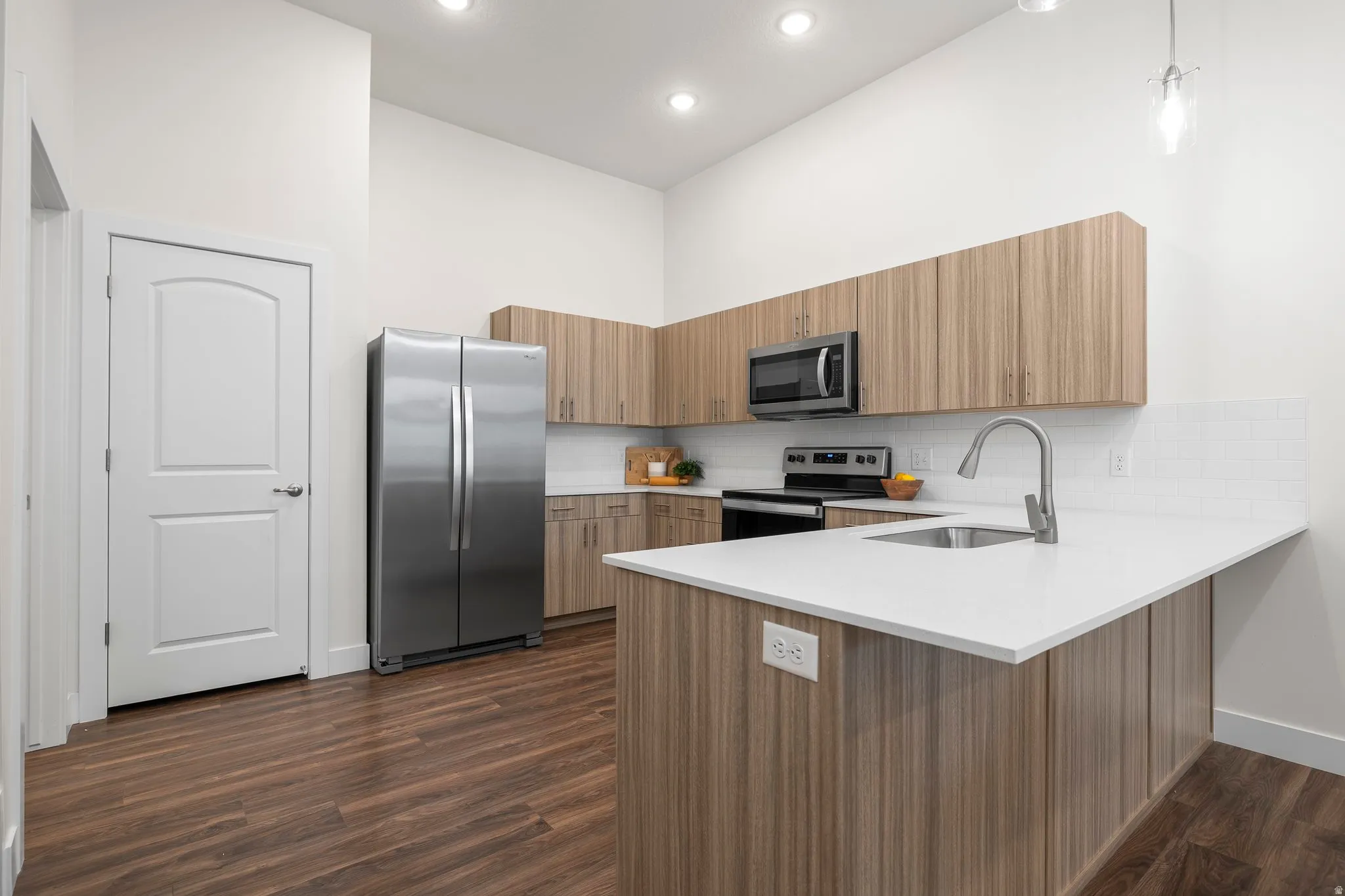 Modern Kitchen with quartz counters and stainless steel appliances. *Fridge not included*