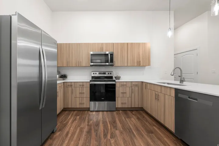 Modern Kitchen with quartz counters and stainless steel appliances. *Fridge not included*