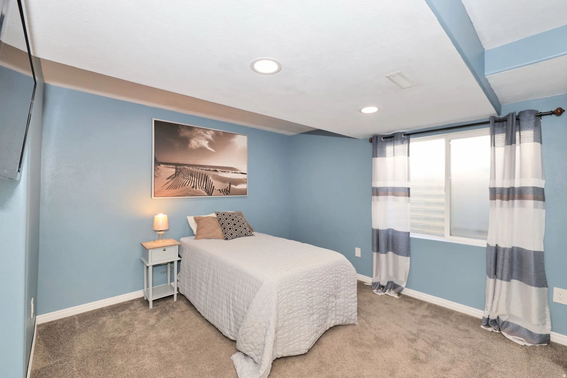 Bedroom featuring light colored carpet and recessed lighting