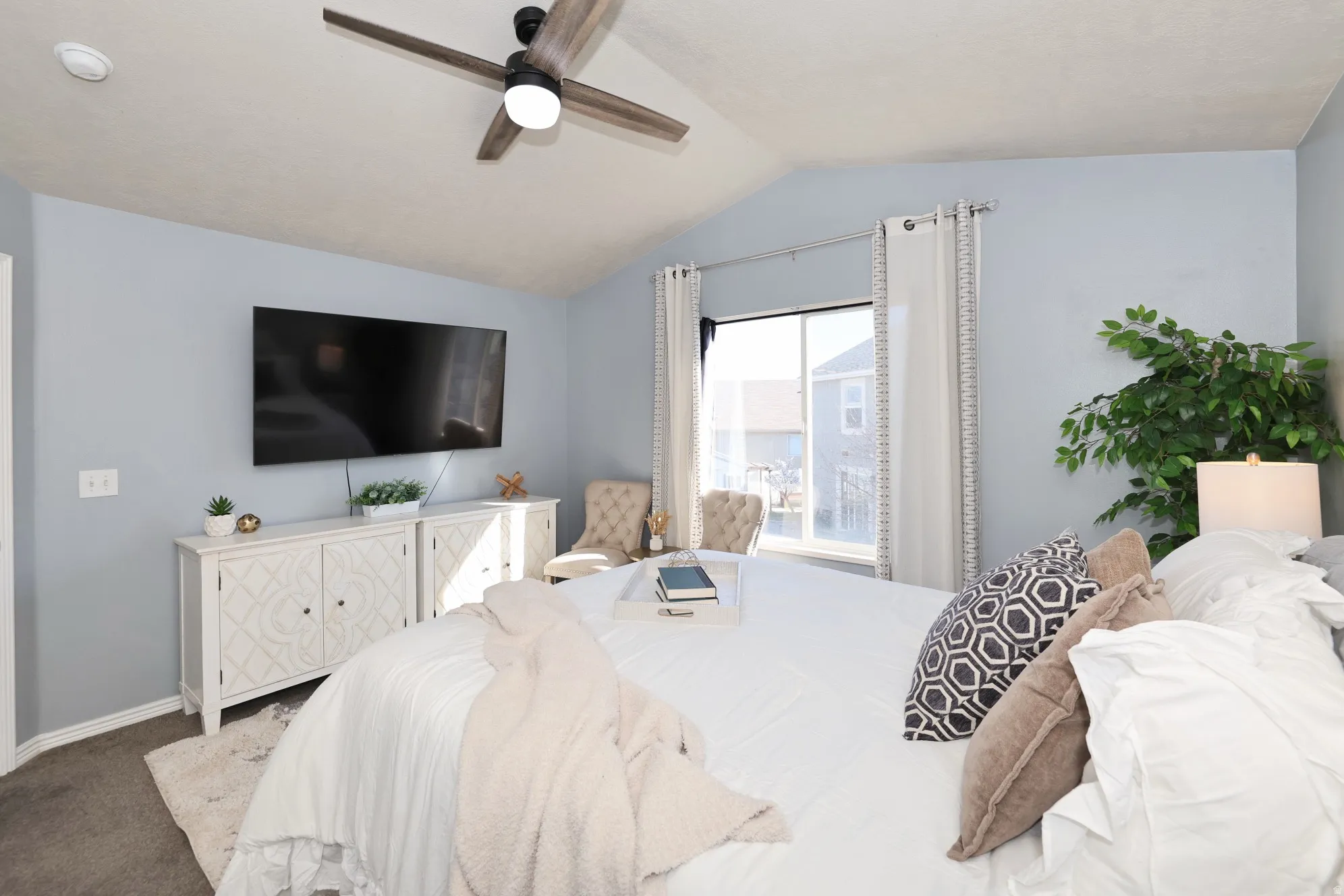 Bedroom featuring carpet and ceiling fan