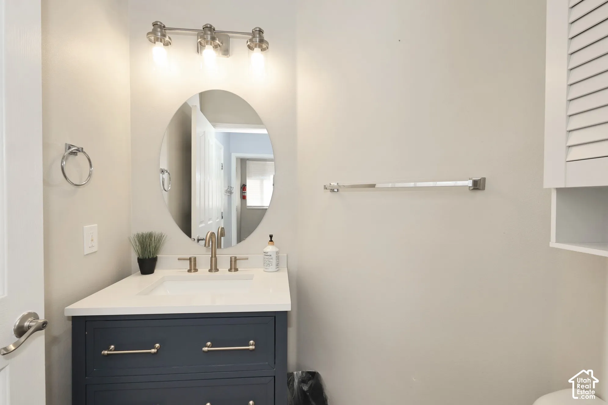Half bathroom featuring vanity