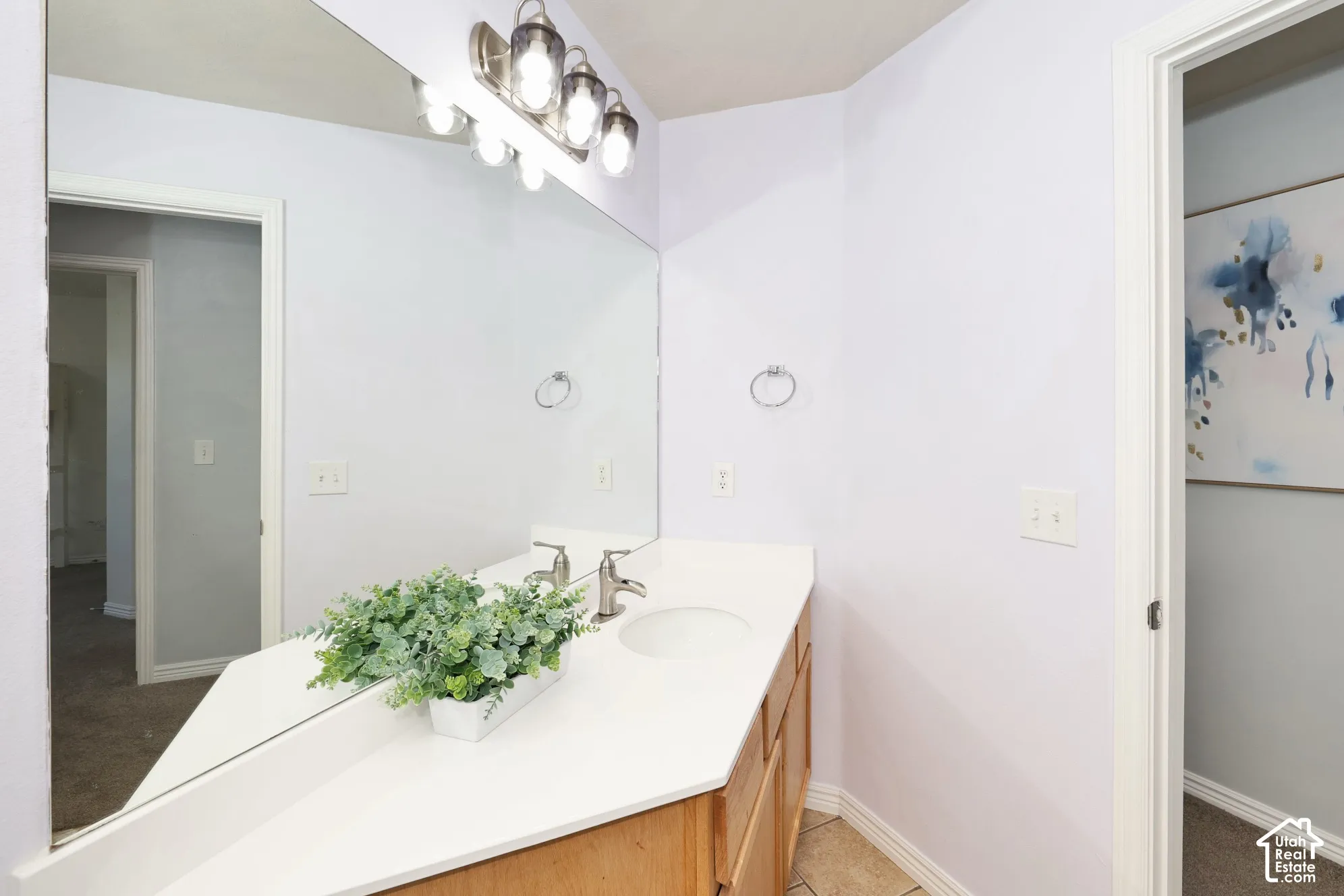 Bathroom featuring vanity and baseboards