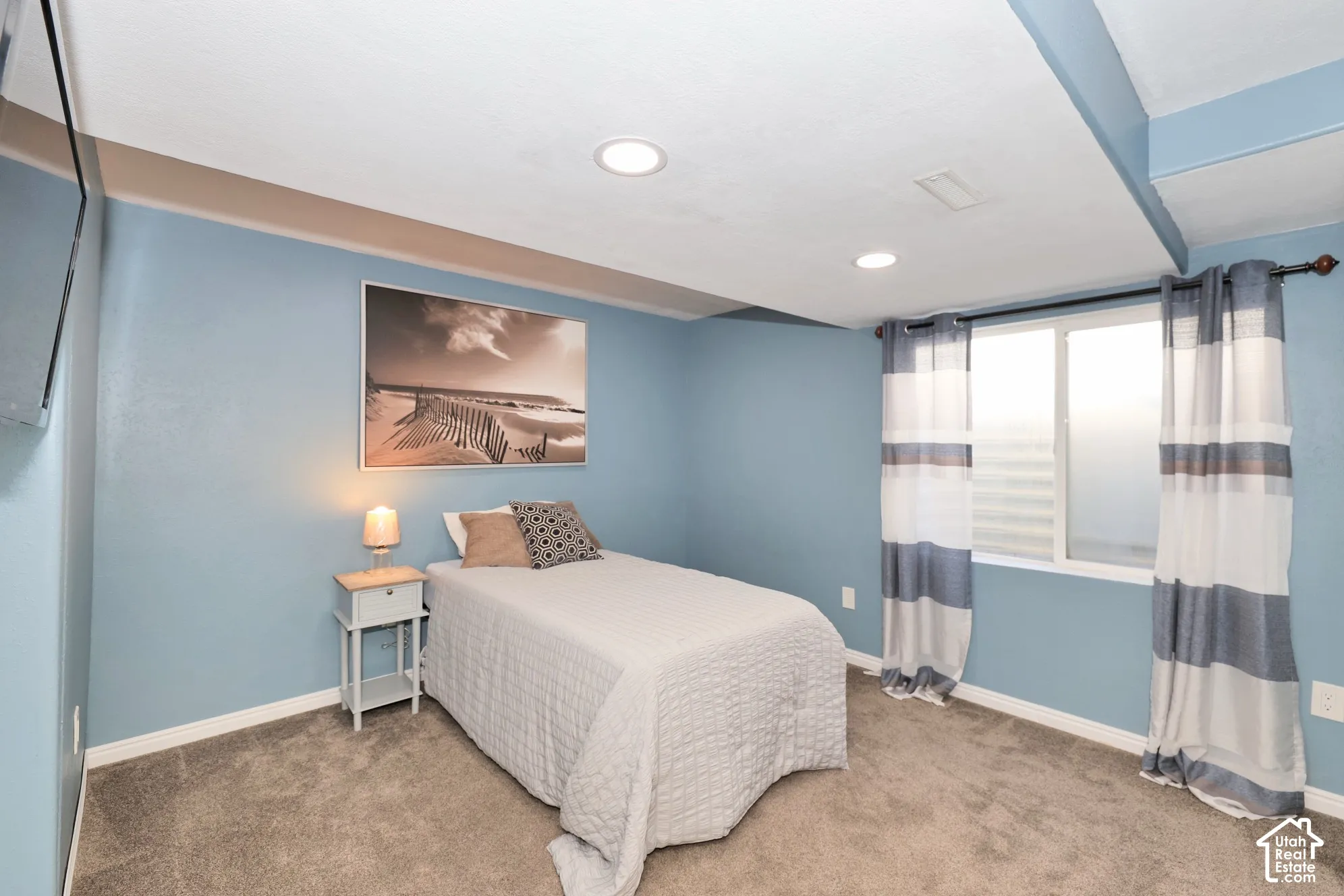 Bedroom featuring light colored carpet and recessed lighting
