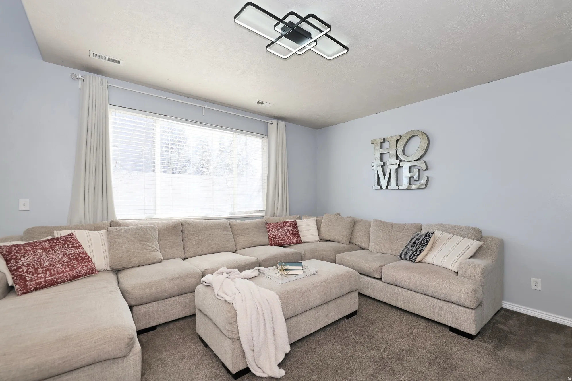 Living room with carpet and baseboards