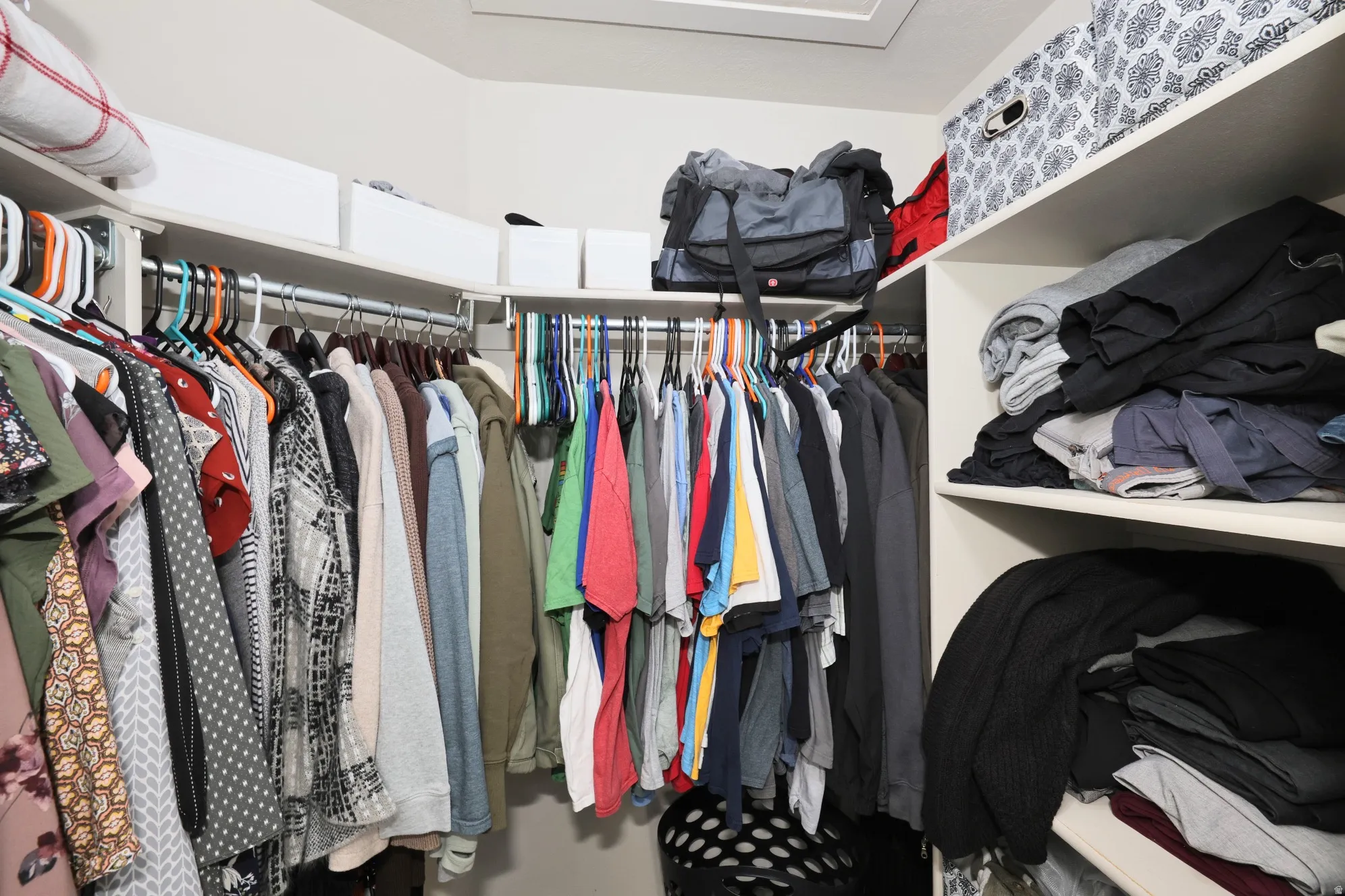 Walk in closet featuring attic access