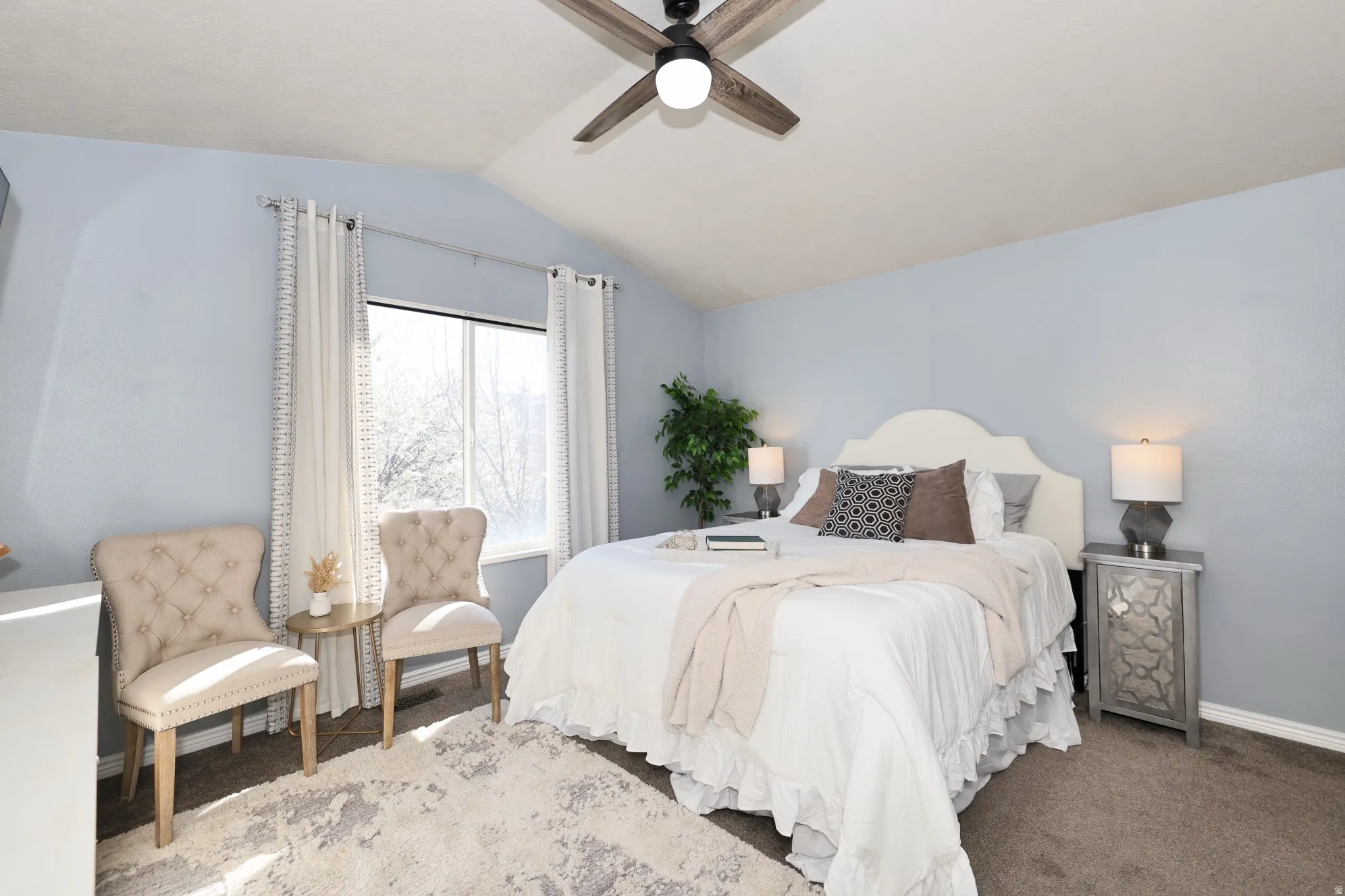 Bedroom featuring carpet floors and ceiling fan