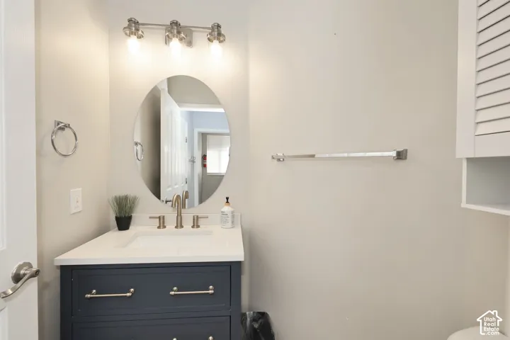 Half bathroom featuring vanity