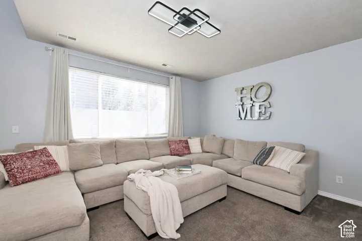 Living room with carpet and baseboards